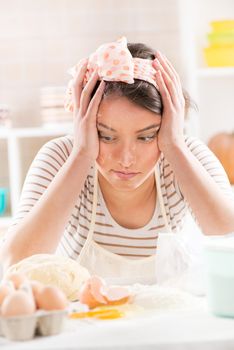 Frustrated Young woman making dough