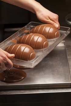 Ingredients and preparation of italian Easter milk and dark choccolate eggs and sweets