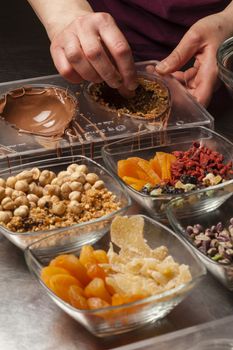 Ingredients and preparation of italian Easter milk and dark choccolate eggs and sweets