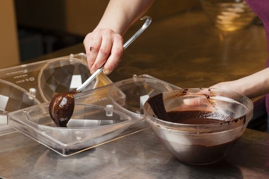 Ingredients and preparation of italian Easter milk and dark choccolate eggs and sweets