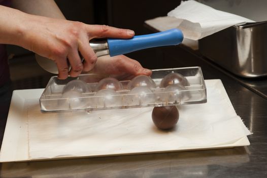 Ingredients and preparation of italian Easter milk and dark choccolate eggs and sweets