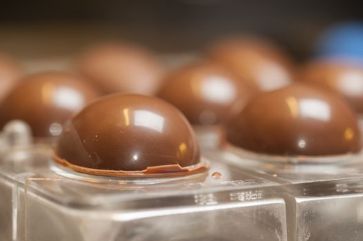 Ingredients and preparation of italian Easter milk and dark choccolate eggs and sweets