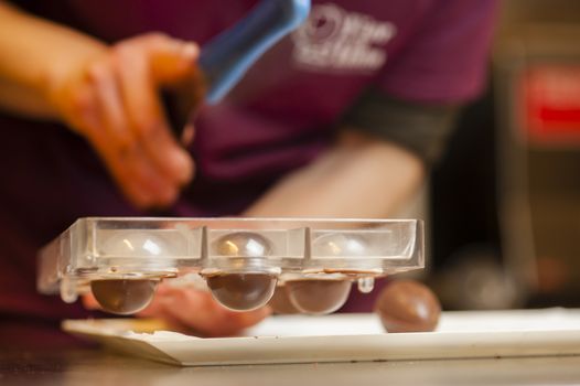 Ingredients and preparation of italian Easter milk and dark choccolate eggs and sweets