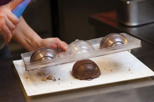 Ingredients and preparation of italian Easter milk and dark choccolate eggs and sweets