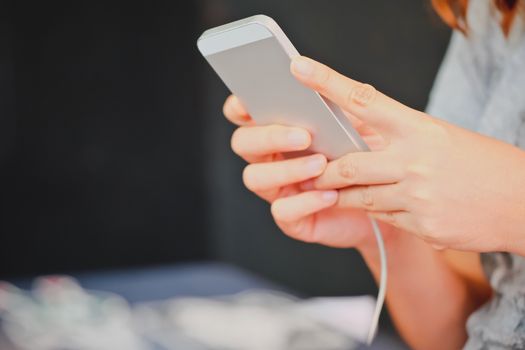 Close up of young woman using a smartphone,Social Media Life