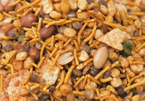 Dry roasted Indian snack mix, close-up background