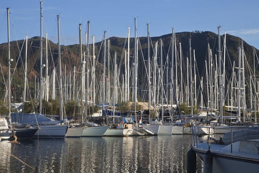 Small yachts in a harbour on a sunny day