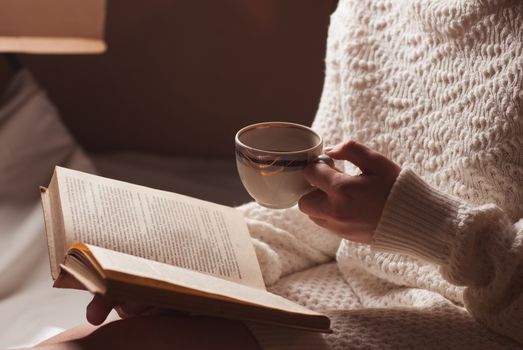 tender portrait of a young girl reading a book 