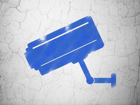 Safety concept: Blue Cctv Camera on textured concrete wall background