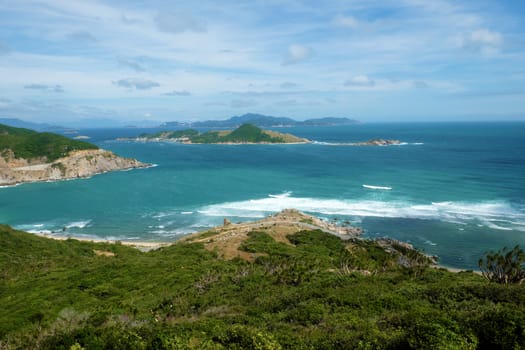 Beautiful panoramic landscape of Vietnam beach at Vinh Hy, Ninh Thuan, road along beach, small island, waves make, fresh air make fantastic holiday when travel at Viet Nam in summer or spring
