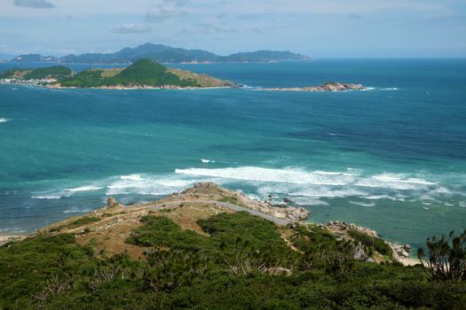 Beautiful panoramic landscape of Vietnam beach at Vinh Hy, Ninh Thuan, road along beach, small island, waves make, fresh air make fantastic holiday when travel at Viet Nam in summer or spring