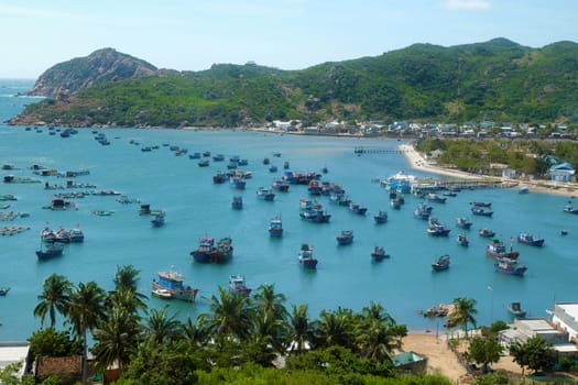 Beautiful panoramic landscape of Vietnam beach, Vinh Hy bay, Ninh Thuan, group of boat anchor at fishing village,  fantastic holiday when travel at Viet Nam in summer or spring