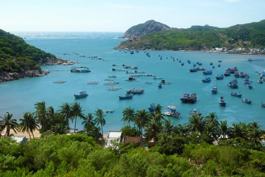 Beautiful panoramic landscape of Vietnam beach, Vinh Hy bay, Ninh Thuan, group of boat anchor at fishing village,  fantastic holiday when travel at Viet Nam in summer or spring