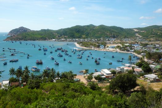 Beautiful panoramic landscape of Vietnam beach, Vinh Hy bay, Ninh Thuan, group of boat anchor at fishing village,  fantastic holiday when travel at Viet Nam in summer or spring