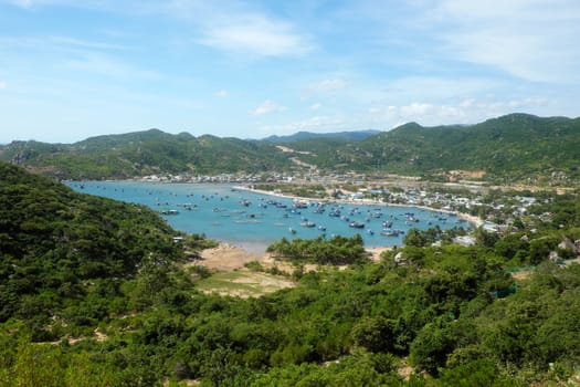 Beautiful panoramic landscape of Vietnam beach, Vinh Hy bay, Ninh Thuan, group of boat anchor at fishing village,  fantastic holiday when travel at Viet Nam in summer or spring