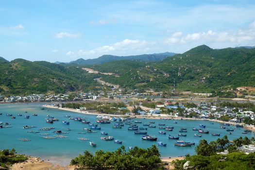 Beautiful panoramic landscape of Vietnam beach, Vinh Hy bay, Ninh Thuan, group of boat anchor at fishing village,  fantastic holiday when travel at Viet Nam in summer or spring