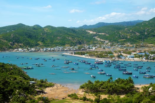 Beautiful panoramic landscape of Vietnam beach, Vinh Hy bay, Ninh Thuan, group of boat anchor at fishing village,  fantastic holiday when travel at Viet Nam in summer or spring