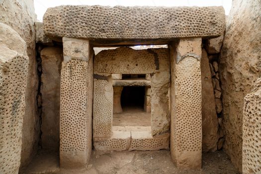 Door and window view of ancient limestone structures of Hagar Qim and Gnajdra Temples in Qrendi, Malta.