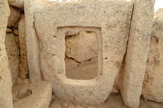 Door and window view of ancient limestone structures of Hagar Qim and Gnajdra Temples in Qrendi, Malta.