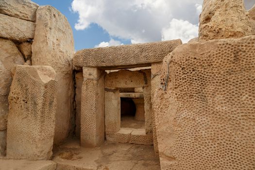 Door and window view of ancient limestone structures of Hagar Qim and Gnajdra Temples in Qrendi, Malta.