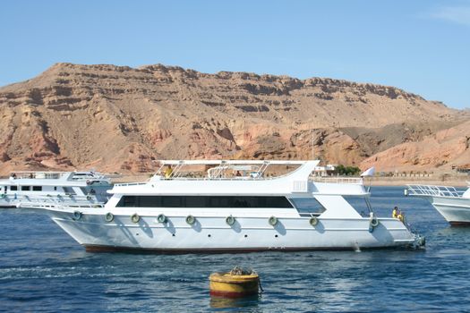 The powerboat in the Red Sea against small mountains of the Sinai Peninsula