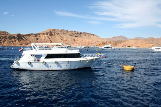 The powerboat in the Red Sea against small mountains of the Sinai Peninsula

