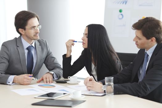 Business people discussing financial reports during a meeting