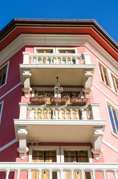 Detail of the facade of a hexagon pink palace.