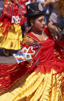 Lady in traditional Andean costume performing at the annual Carnaval Andino con la Fuerza del Sol in Arica, Chile.