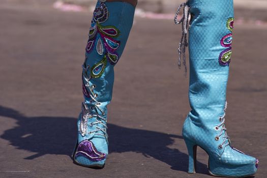 Colourful boots worn by a female member of a Morenada dance group performing as part of the Carnaval Andino con la Fuerza del Sol in Arica, Chile.