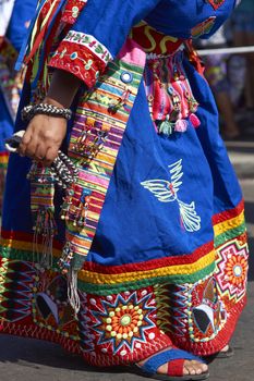 Detail of colourful costume worn by Tinku dancers performing a traditional ritual dance as part of the Carnaval Andino con la Fuerza del Sol in Arica, Chile.