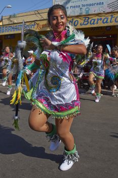 Young woman performing in a Tobas dance group at the Carnaval Andino con la Fuerza del Sol in Arica, Chile. The dance originates in Oruro, Bolivia.