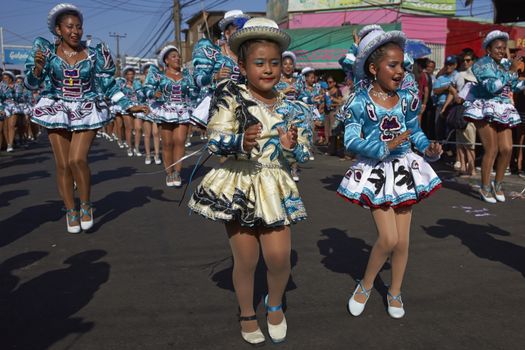 Caporales dance group performing at the annual Carnaval Andino con la Fuerza del Sol in Arica, Chile.