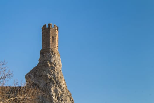 Rocks, where was former fortress with a Maiden Tower, part of ruins of castle Devin in Slovakia. Bright blue sky.