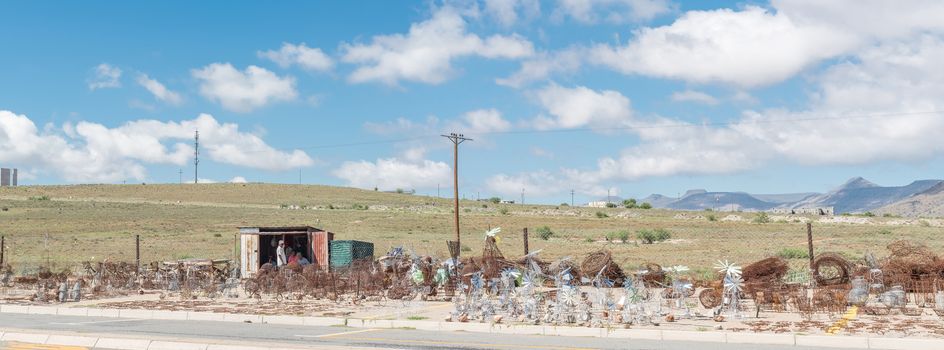 Wire-craft entrepreneurs selling windmills and other crafts