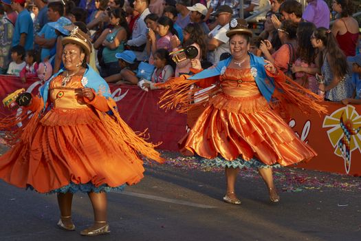 Morenada dancers in traditional Andean costume performing at the annual Carnaval Andino con la Fuerza del Sol in Arica, Chile.