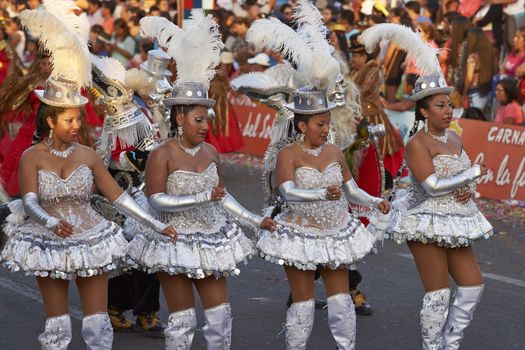 Morenada dance group in traditional Andean costumes performing at the annual Carnaval Andino con la Fuerza del Sol in Arica, Chile.