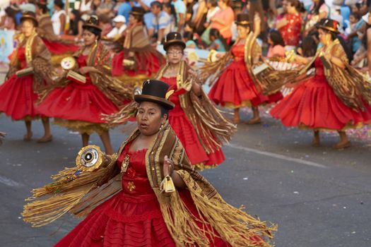 Morenada dance group in traditional Andean costumes performing at the annual Carnaval Andino con la Fuerza del Sol in Arica, Chile.