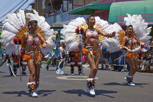 Tobas dancers in traditional Andean costume performing at the annual Carnaval Andino con la Fuerza del Sol in Arica, Chile.