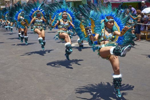 Tobas dancers in traditional Andean costume performing at the annual Carnaval Andino con la Fuerza del Sol in Arica, Chile.