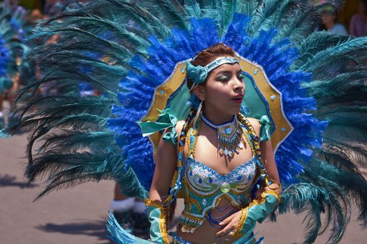 Tobas dancers in traditional Andean costume performing at the annual Carnaval Andino con la Fuerza del Sol in Arica, Chile.