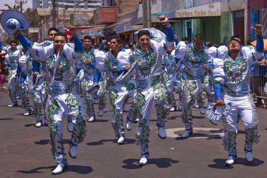 Caporales dance group performing at the annual Carnaval Andino con la Fuerza del Sol in Arica, Chile.