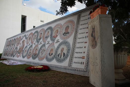 TUNISIA, Tunis: A memorial is on display at the Bardo National Museum in Tunis on March 18, 2016, commemorating the one-year anniversary of the terror attack there. The assault by Islamic State militants left 24 people dead that day in 2015. The pictured memorial bears the victims' faces.