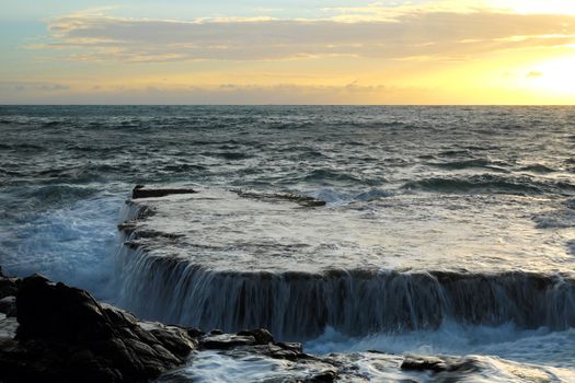 Wonderful seascape at Nui Chua national park, Ninh Thuan, Viet Nam, waves on large rock and make amazing fall in Hang Rai at sunrise, amazing landscape at Vietnam beach, masterpiece place for travel