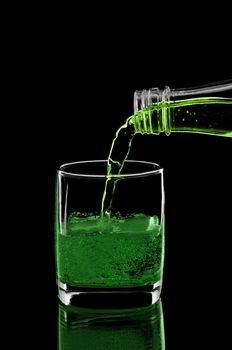 Green drink with ice and splashes. Russia