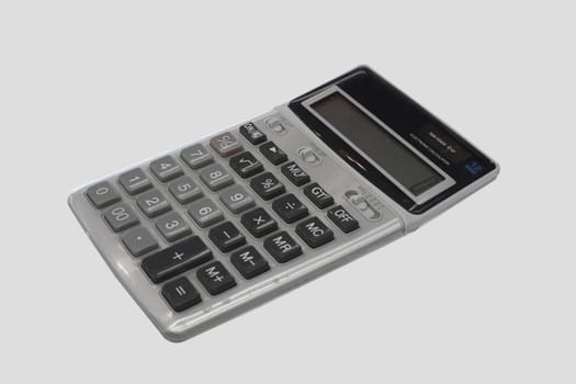 Electronic calculator isolated on grey background