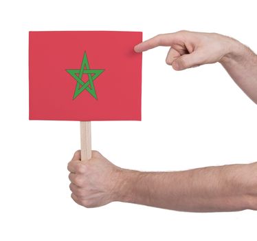 Hand holding small card, isolated on white - Flag of Morocco