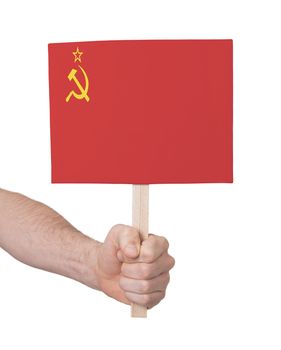 Hand holding small card, isolated on white - Flag of the USSR