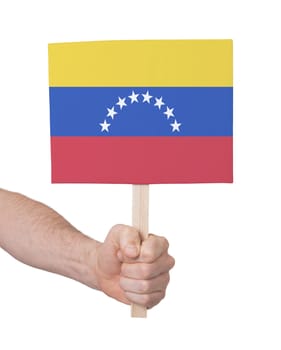 Hand holding small card, isolated on white - Flag of Venezuela