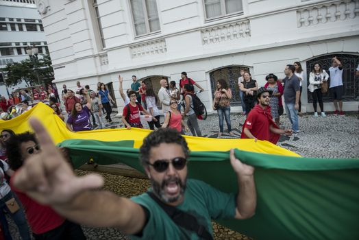 BRAZIL, Curitiba: A pro-government protester demonstrates in support of President Dilma Rousseff and former President Luiz Inacio Lula da Silva in Curitiba, Brazil, on March 18, 2016. Brazilian President Dilma Rousseff's supporters took to the streets Friday to fight back at attempts to oust her, as a flurry of court battles raged over her controversial cabinet appointment of predecessor Luiz Inacio Lula da Silva. 